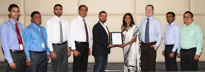EFL staff holding award