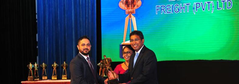 EFL staff holding award