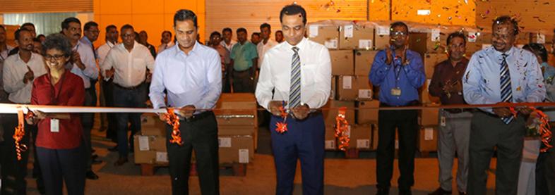 EFL staff cuts ribbon in new workspace